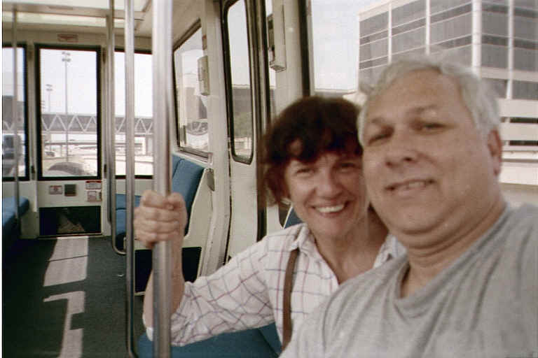 Charles and Susan enjoying sightseeing about the airport in one of the train shuttles.  We only had this shuttle to ourselves a short time -- the rest of the trip between the various terminals it was almost full!